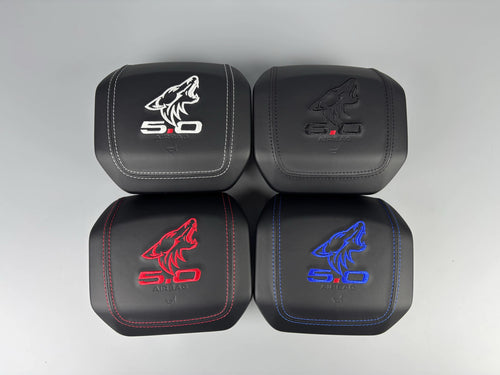 Custom airbag covers with Coyote 5.0 embroidery in white, black, red and blue