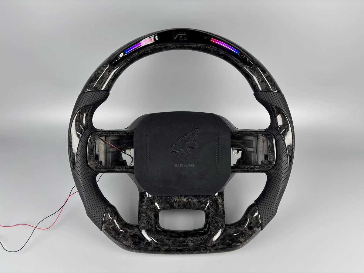 Forged carbon steering wheel with LED shift lights by MAB Customs