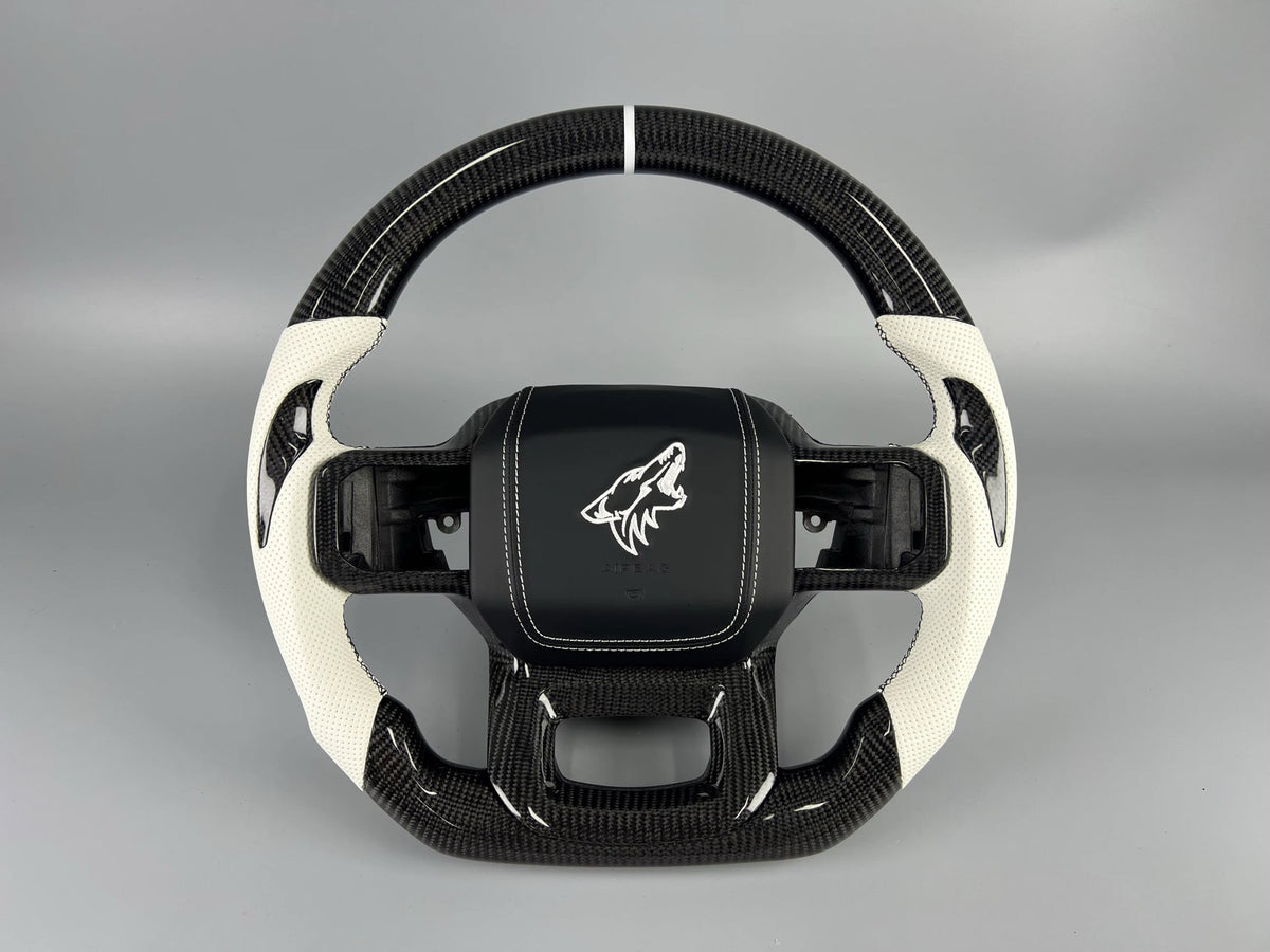 Carbon fiber steering wheel with white leather grips by MAB Customs